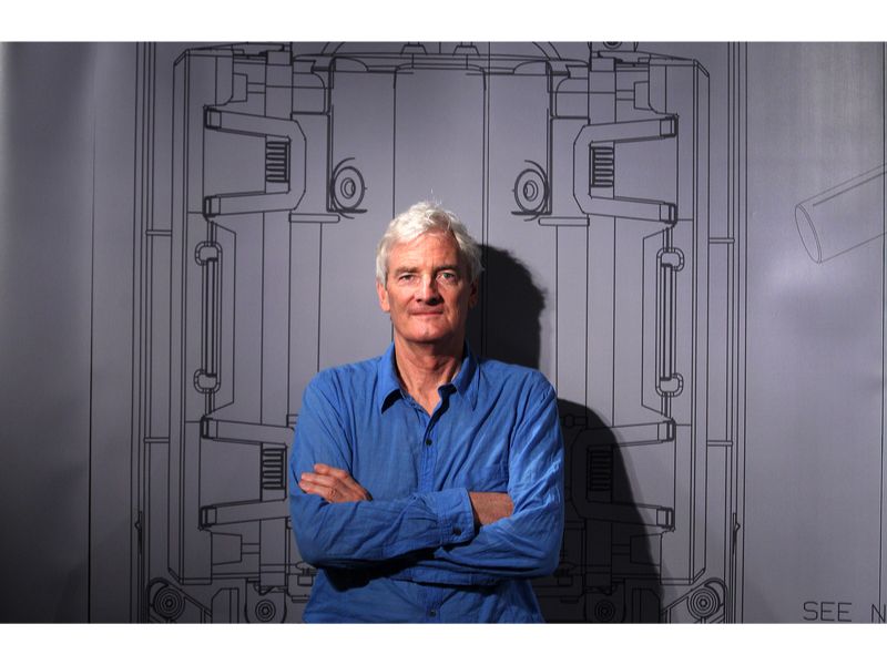 Master inventor James Dyson in front of a pop up wall at Australian event