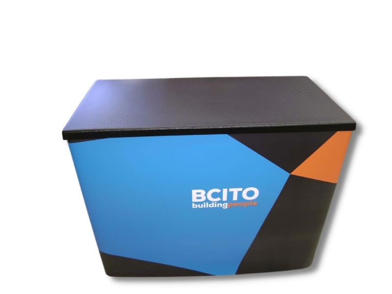 Superlight 1200 demonstration table with branded wrap and black top